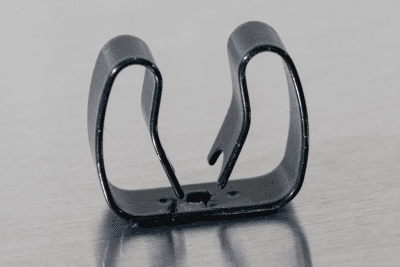 close up of a spring steel gripper clip, tool clip, durable, secure holding, Excellent corrosion and wear resistance, good outdoor weather resistance, mounting hole, made in the usa,  black vinyl, 00050198000047