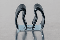 close up of a spring steel gripper clip, tool clip, durable, secure holding, Excellent corrosion and wear resistance, good outdoor weather resistance, mounting hole, made in the usa, silver zinc chromate and black vinyl, 00050198000030
